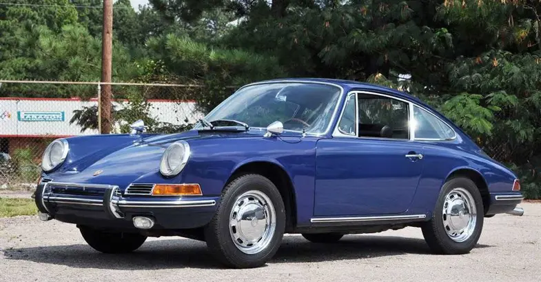 Porsche 911 parked side on, on a sunny day