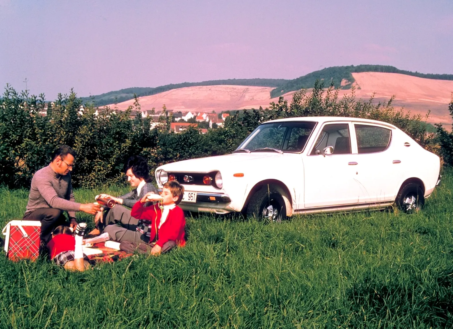 White Nissan with bonnet open