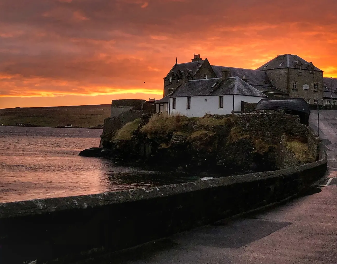 A sunrise above a village on Lerwick in the Shetland Isles