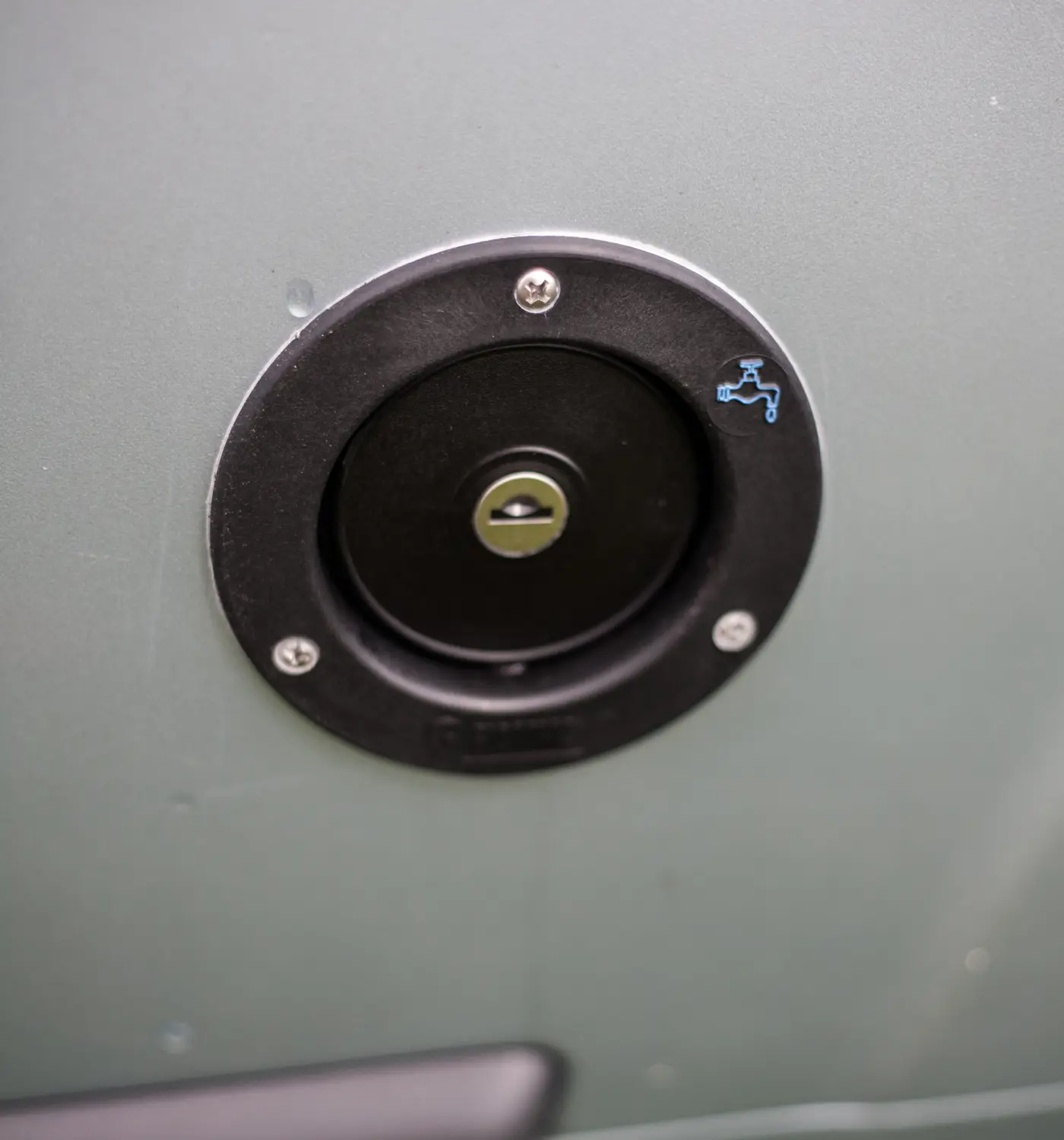 The cap to a water tank on a motorhome