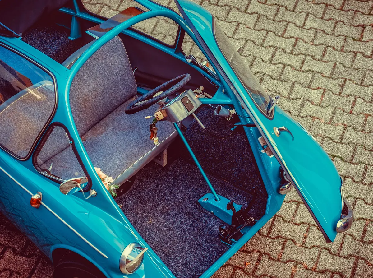 An Isetta with the door open on the front looking in from above