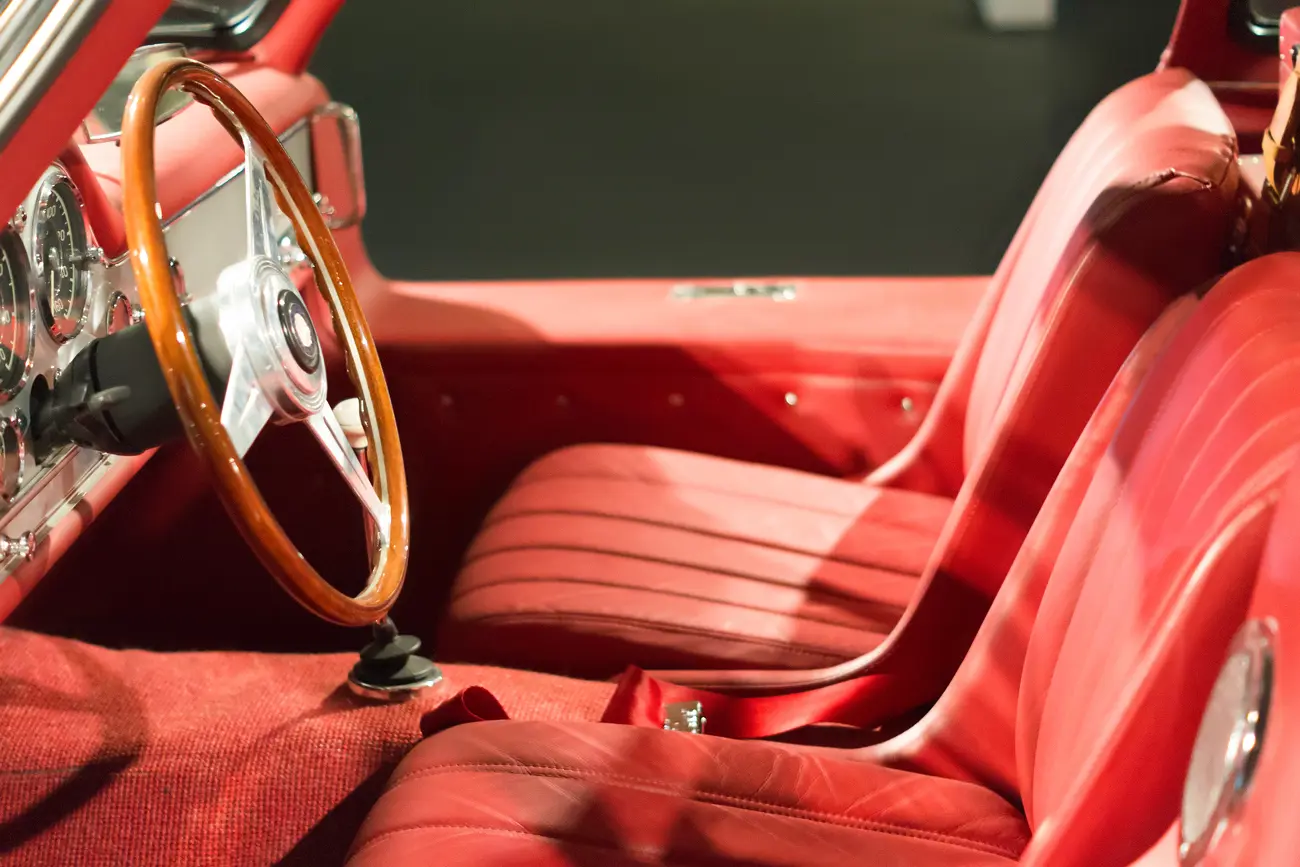 A red leather interior of a convertible classic car