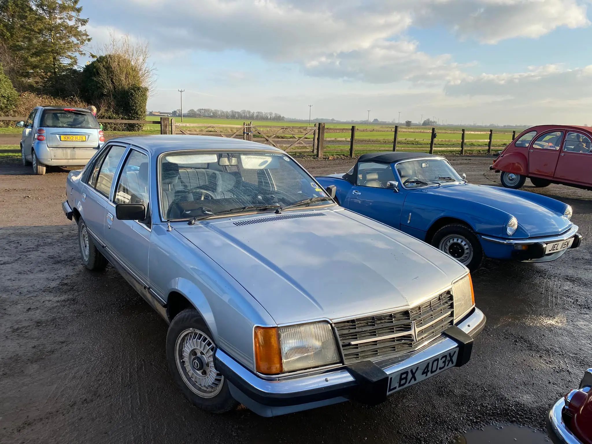 Silver and blue cars