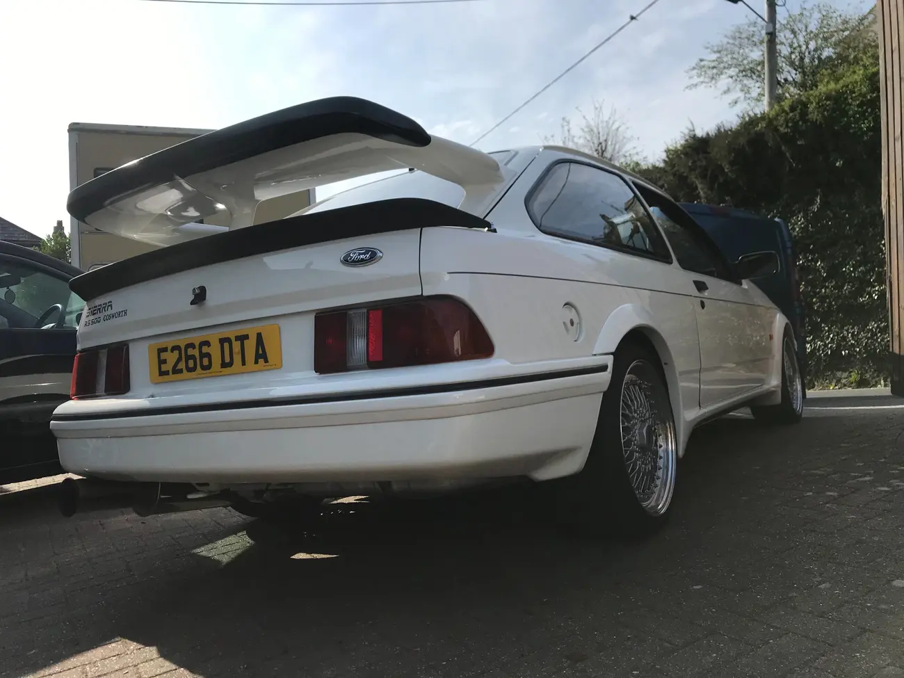 Ford -Sierra -RS500-Cosworth parked outside with rear end showing and spoiler visible 