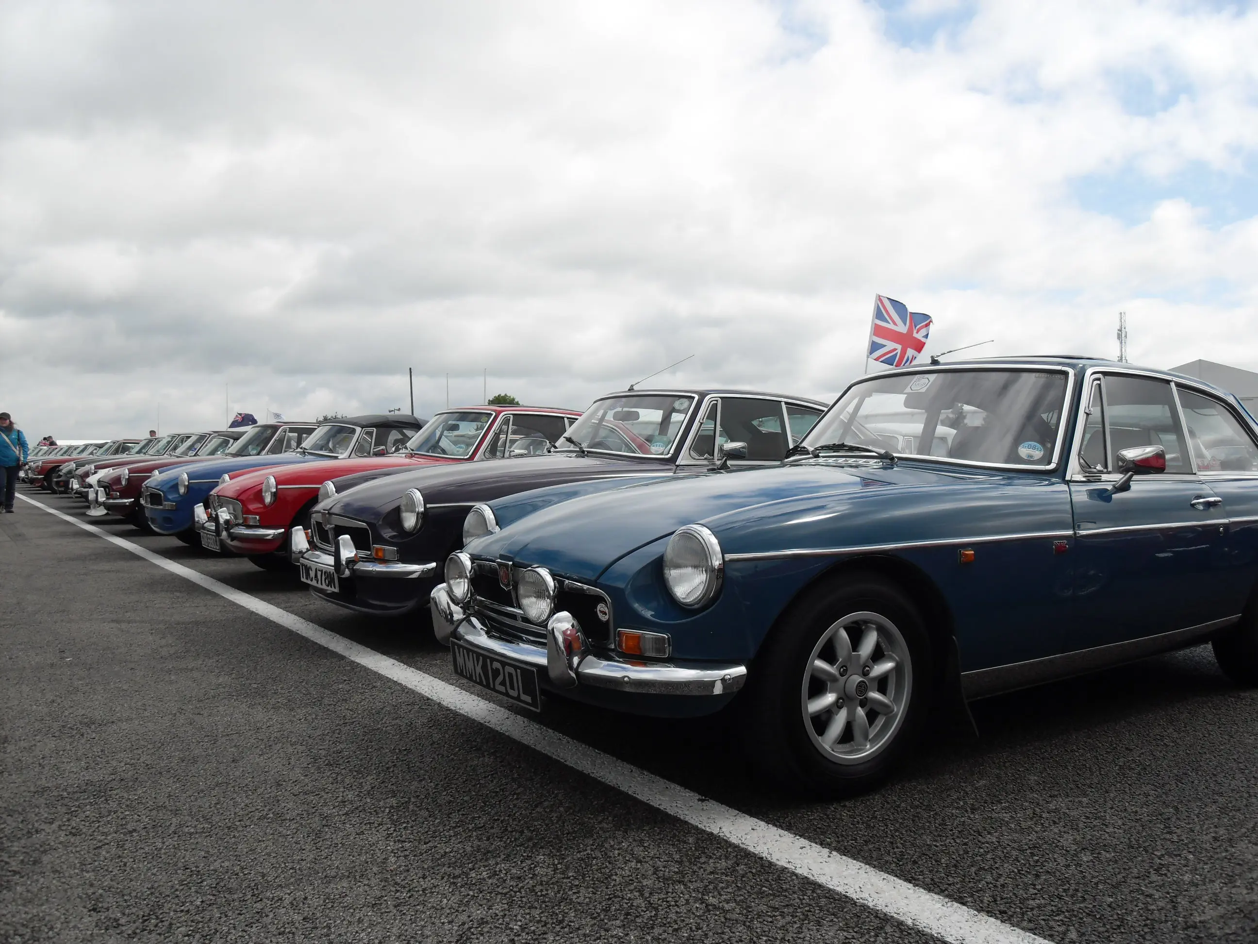 A line-up of MGB's parked at a classic motor show