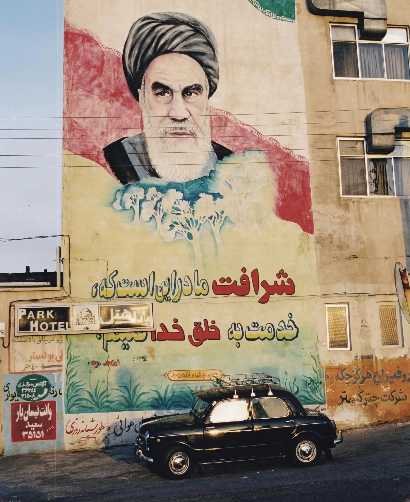 Car by wall painting