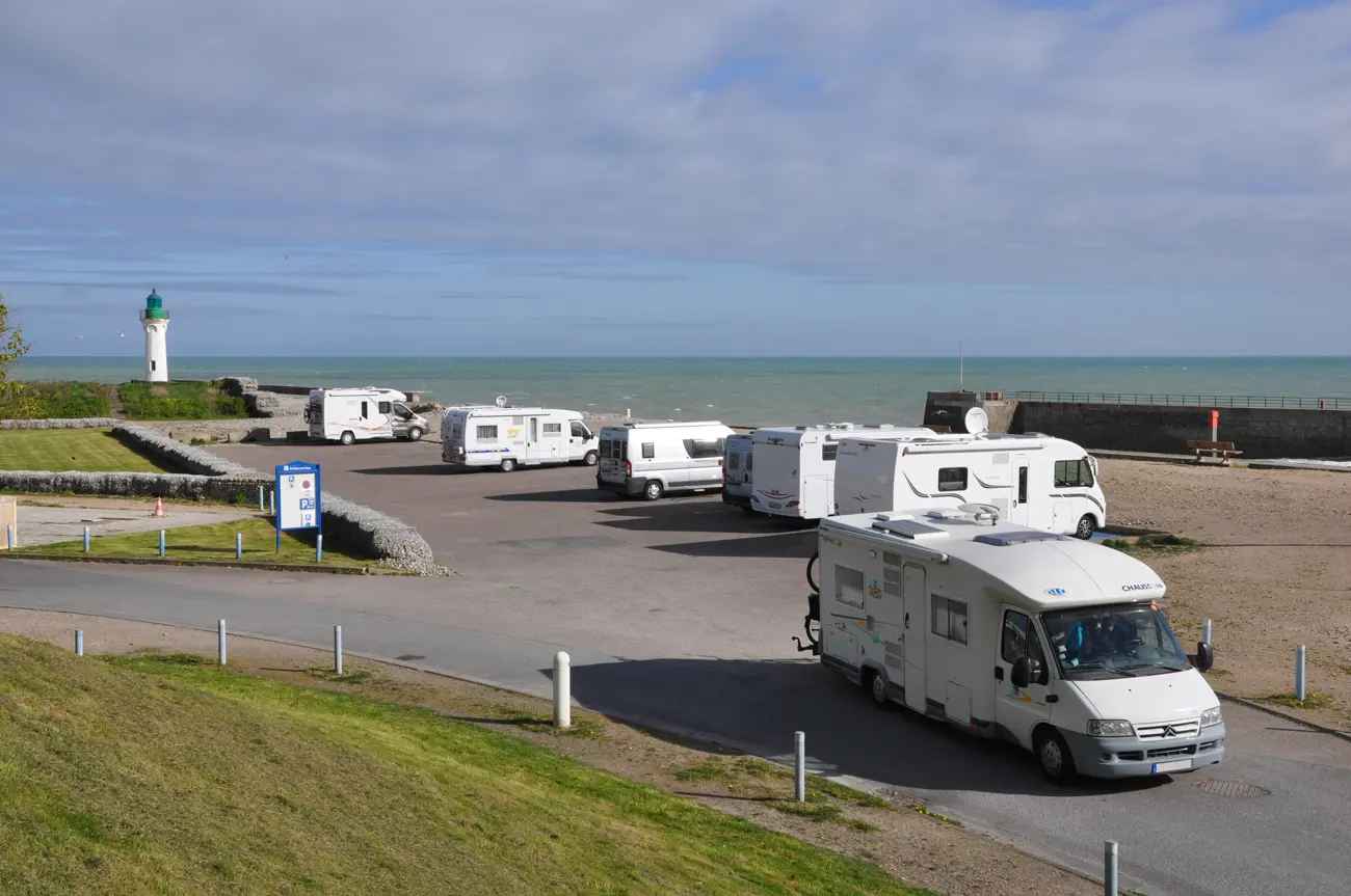 A seafront with some motorhomes parked