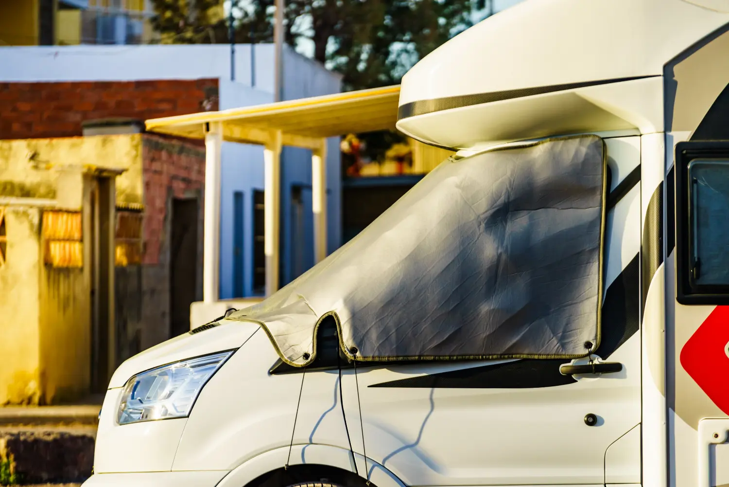 campervan window covered by plastic sheet