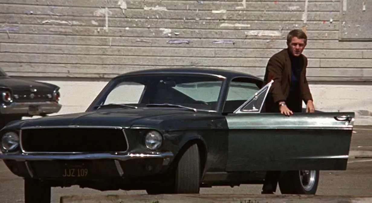 Steve McQueen exiting the Mustang