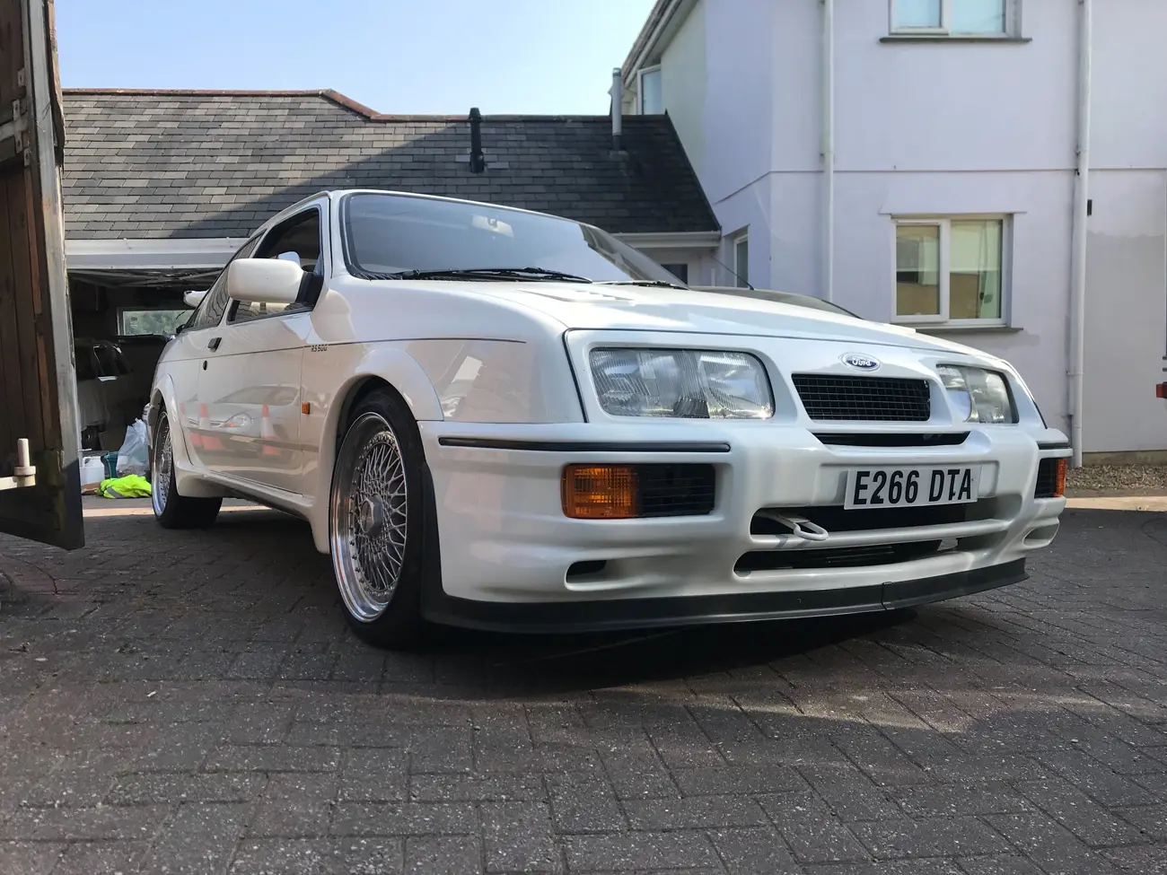 Ford -Sierra -RS500-Cosworth parked outside house side on