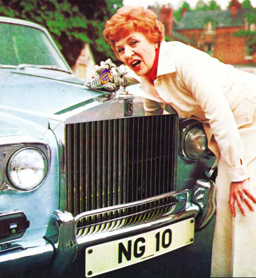 Woman leaning on car