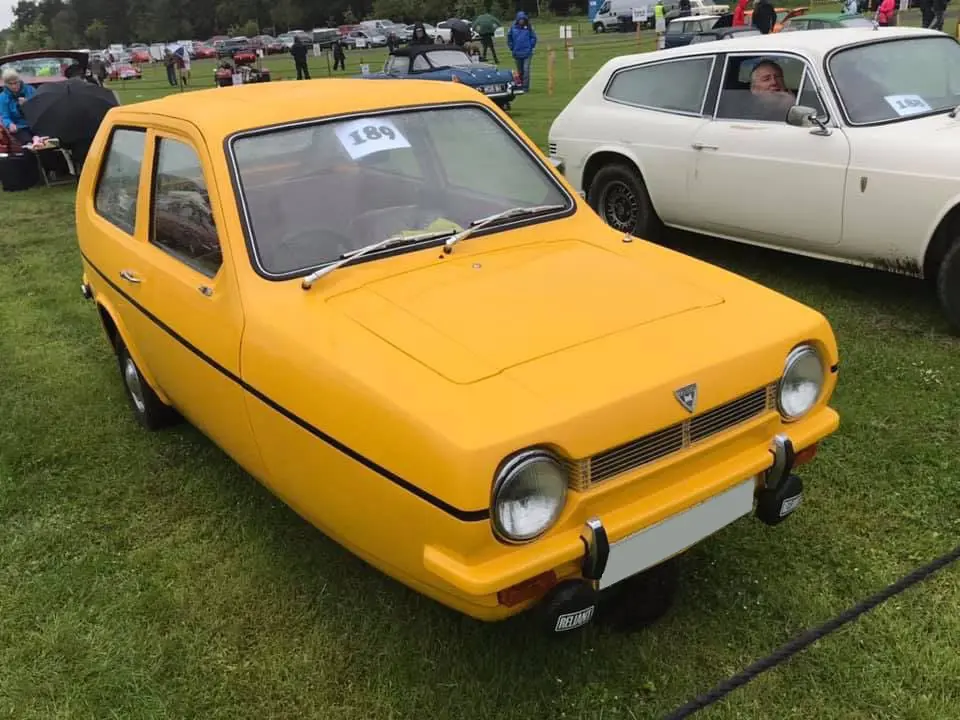 Yellow three wheeled van