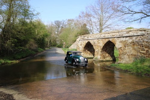 Car driving through water