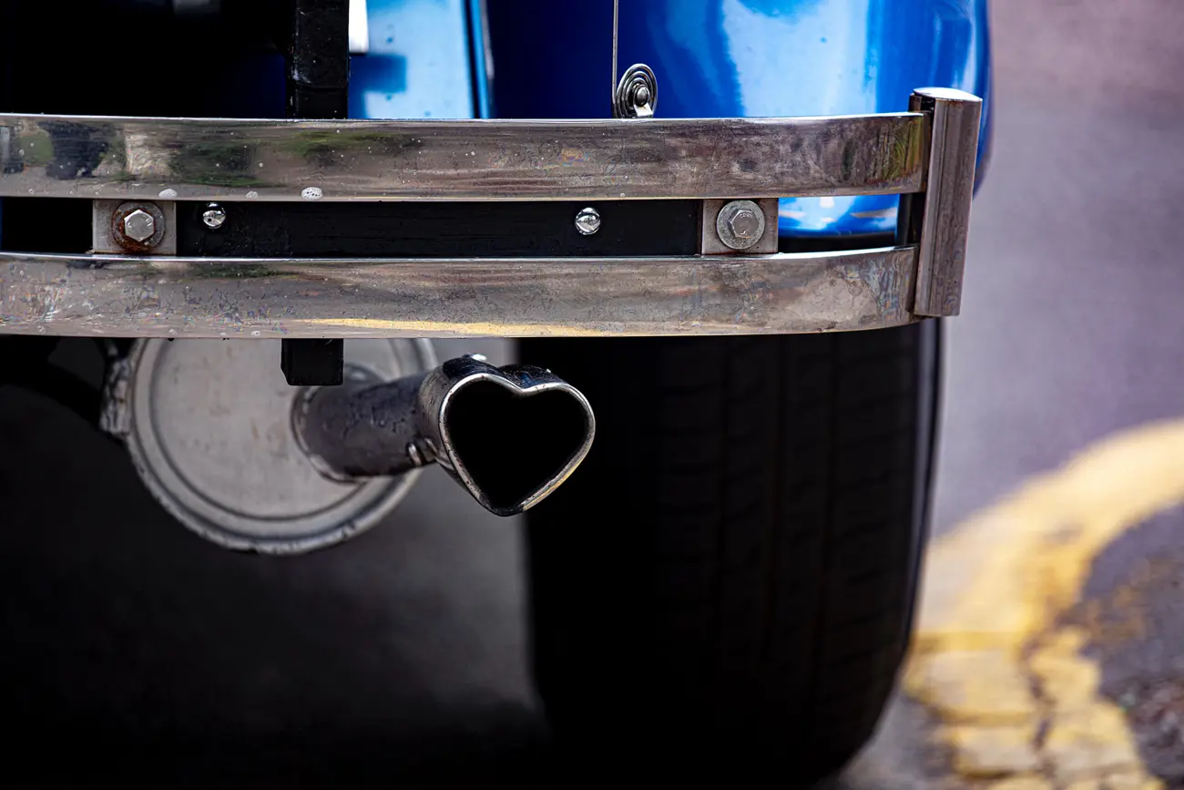 A classic car with a heart shaped exhaust tip