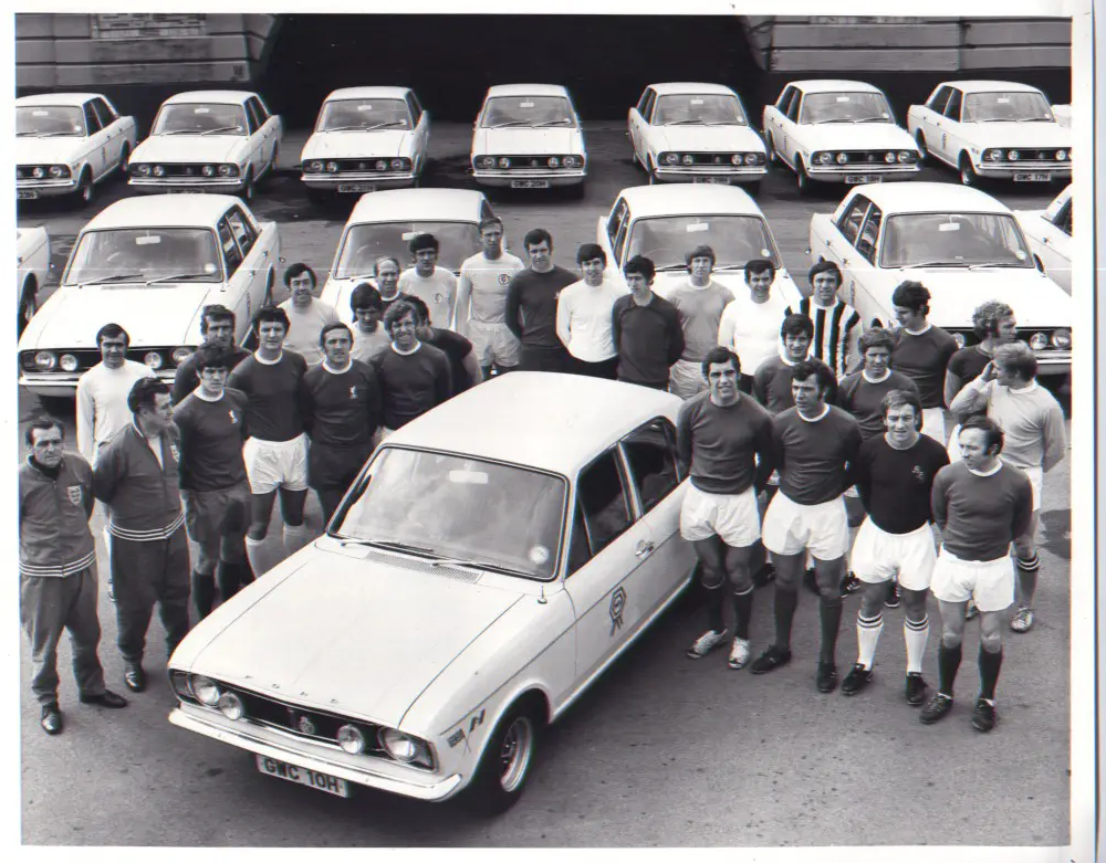 Men stood around car