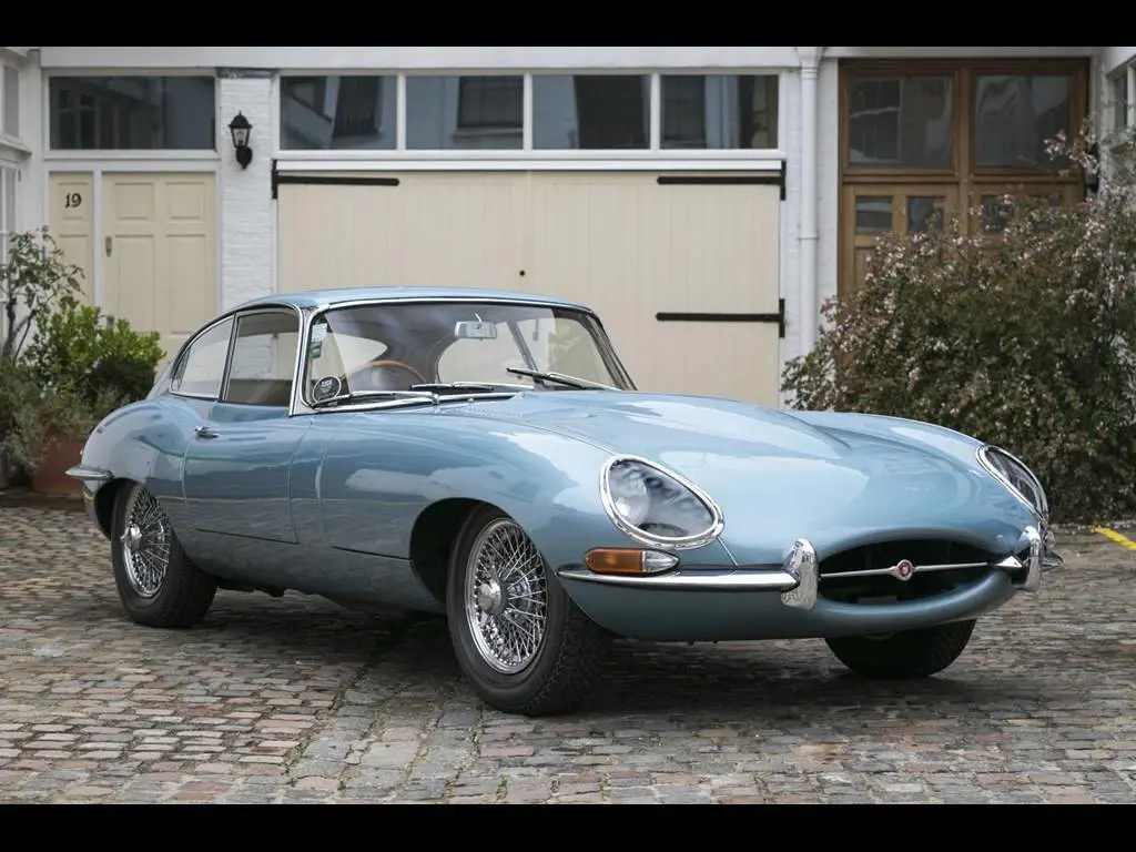 A 1965 Jaguar E-Type parked on a driveway
