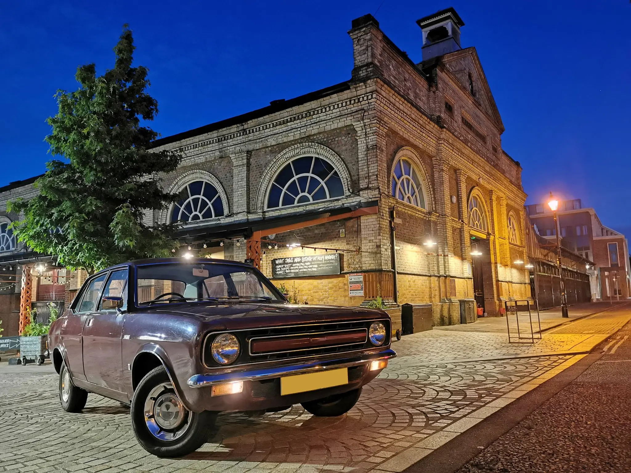 Car next to old building