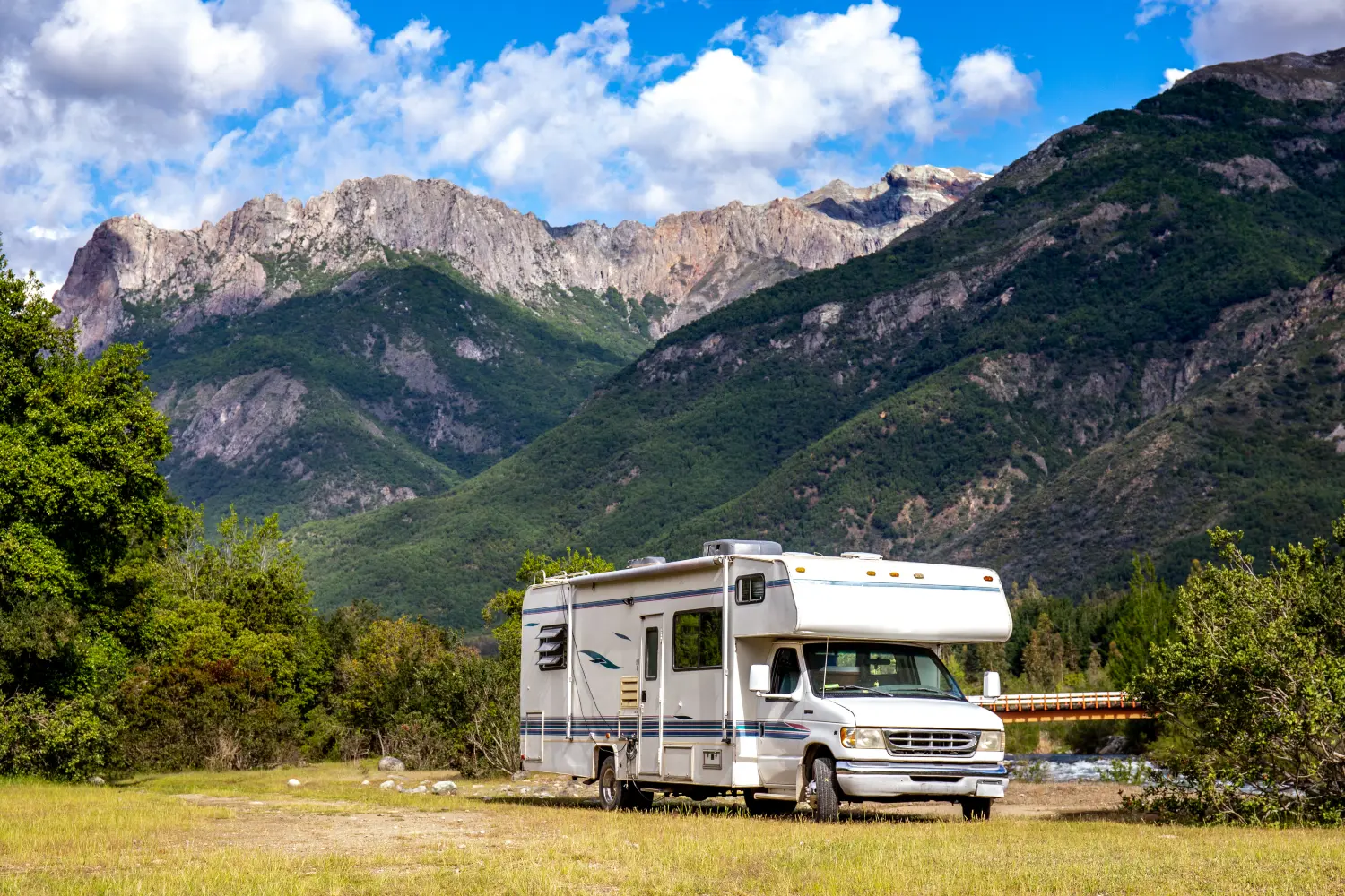 campervan parked next to a mountain