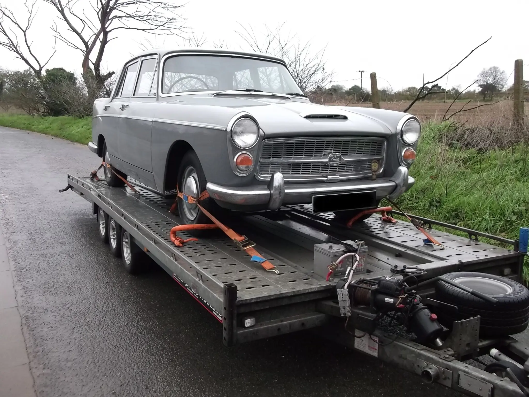 Silver car on trailer