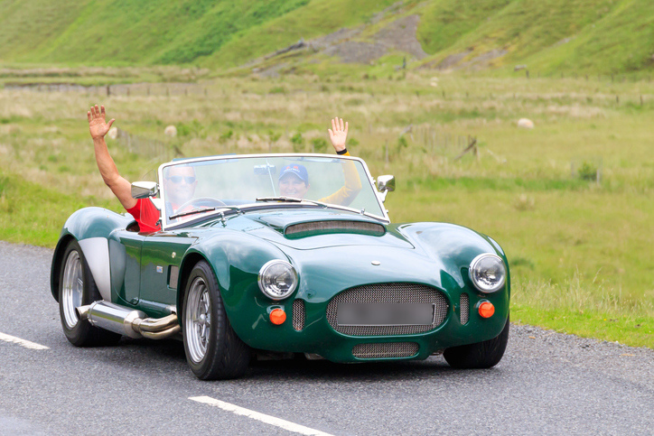 Couple driving a classic