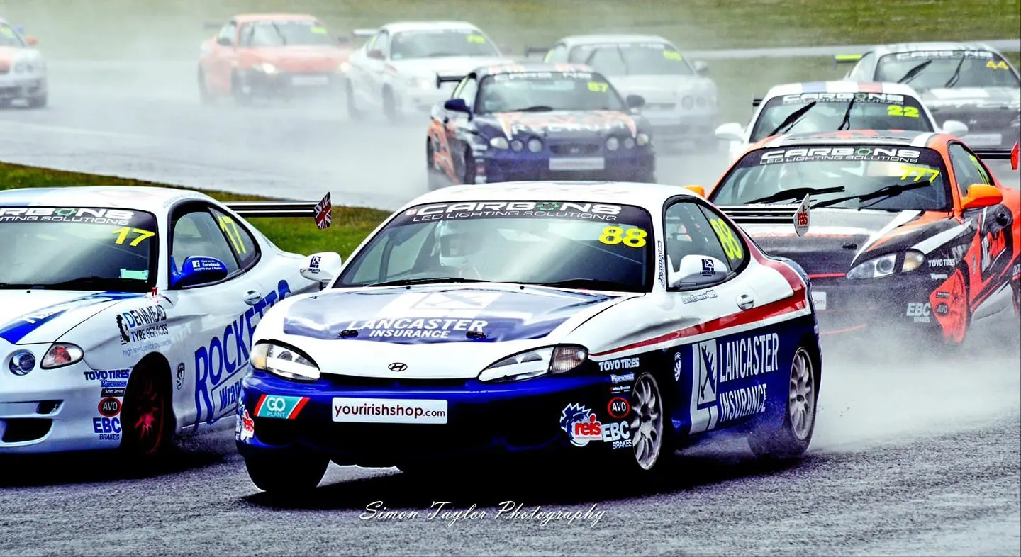 Alex going around the outside of Wayne Rockett at Mallory Park