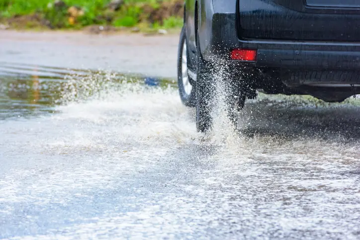 Car driving in flood