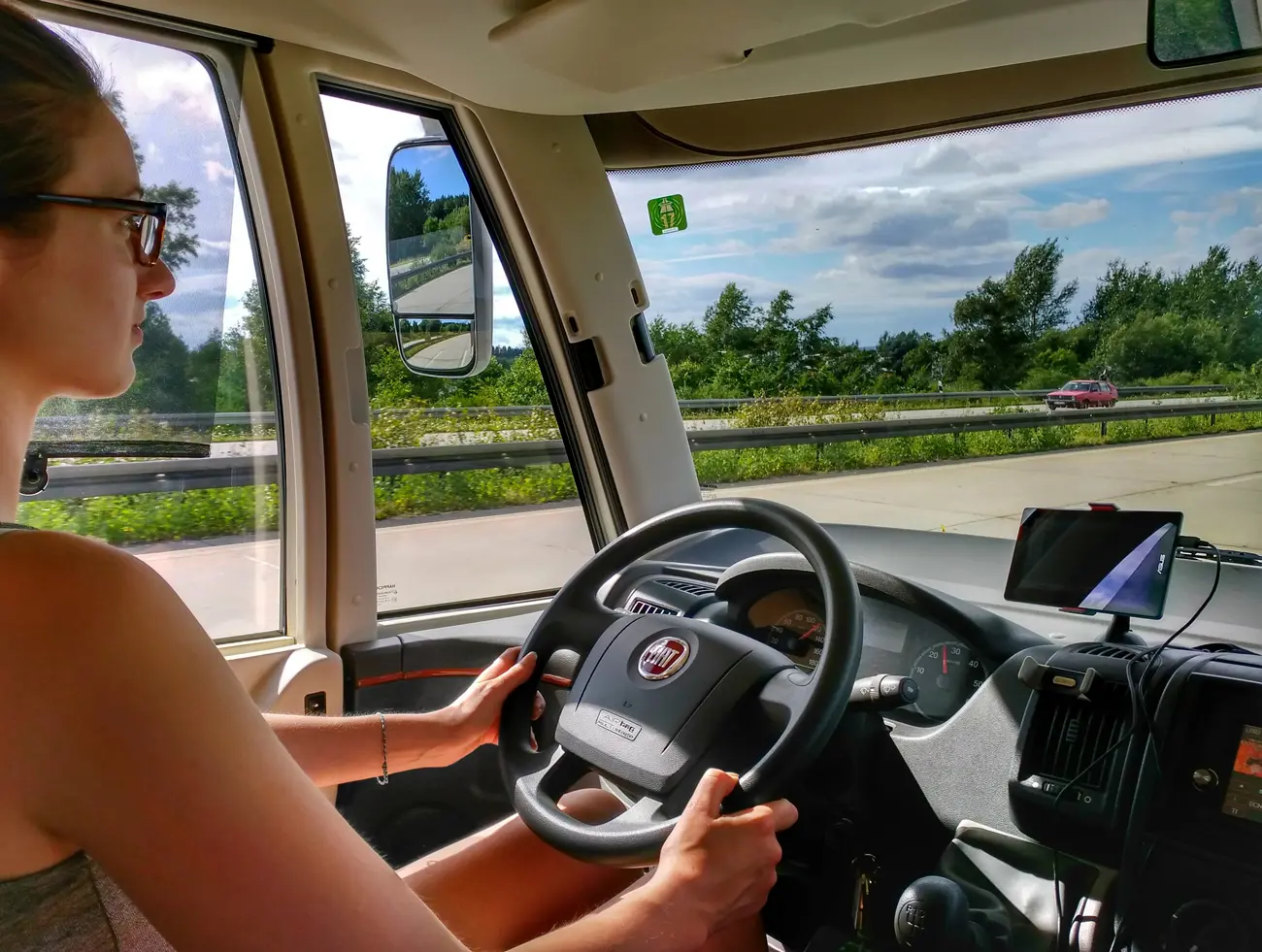 A woman driving a motorhome