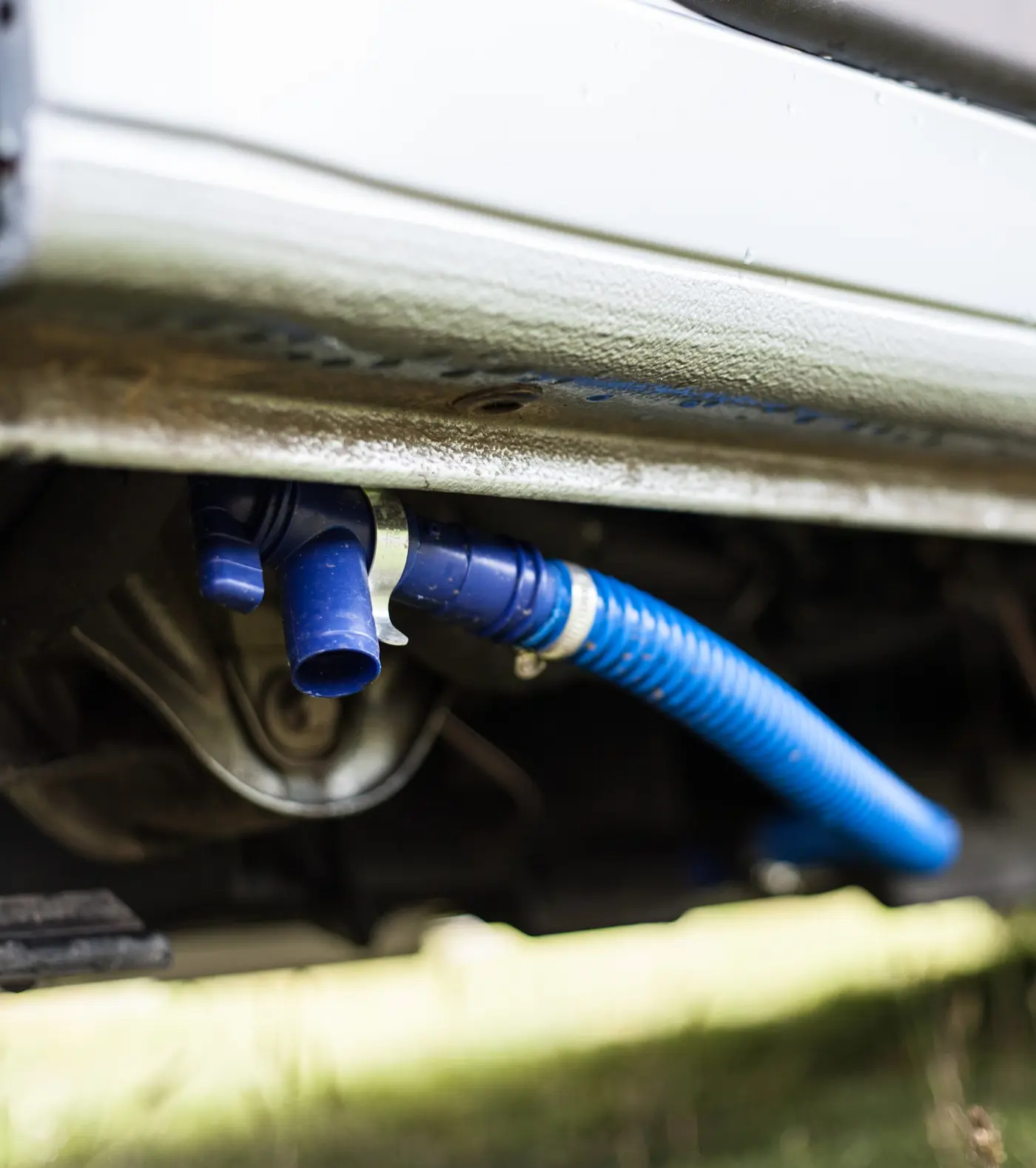A drainage pipe for water attached to the bottom of a motorhome