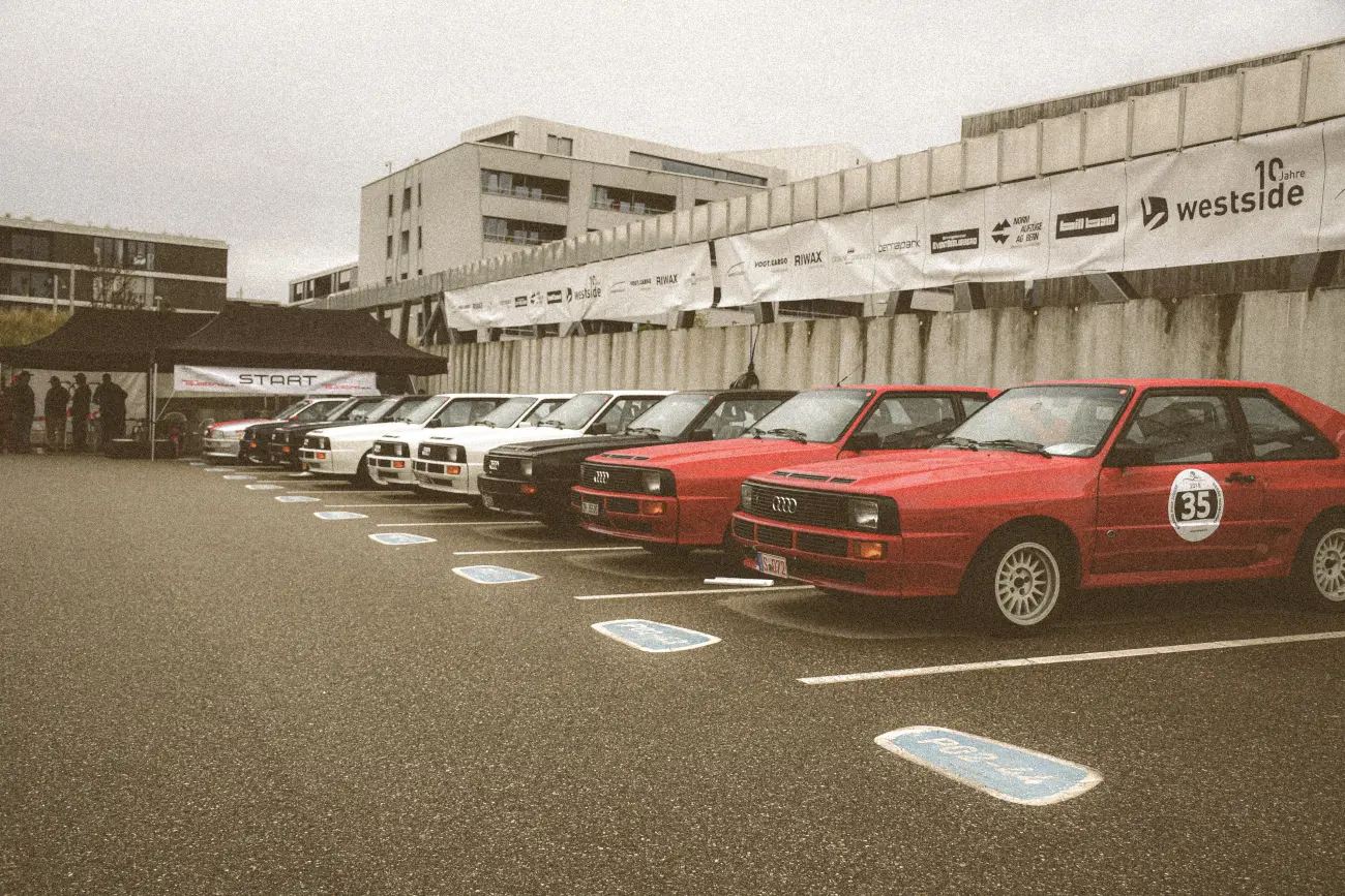 A line of Audi Quattro parked next to eachother