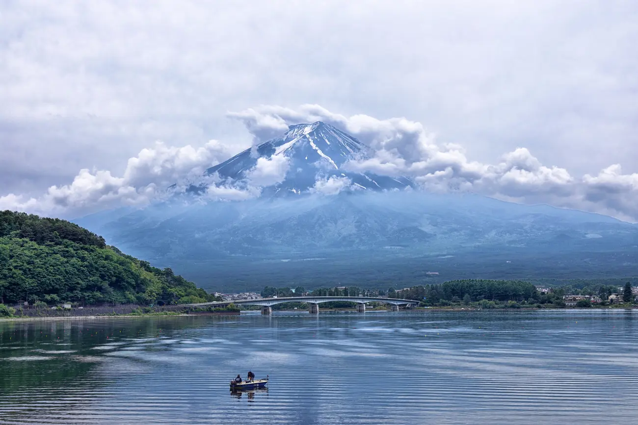 A scenic view across a lake in Japan with Mt. Fuji in the distance