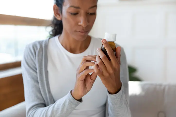 Lady reading medicine