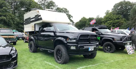 Large black American truck converted into a motorhome