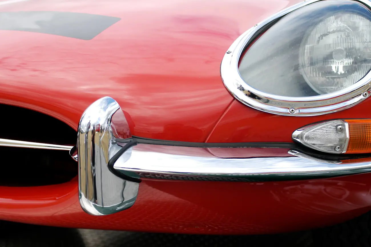 A close up of a jaguar e-type bonnet