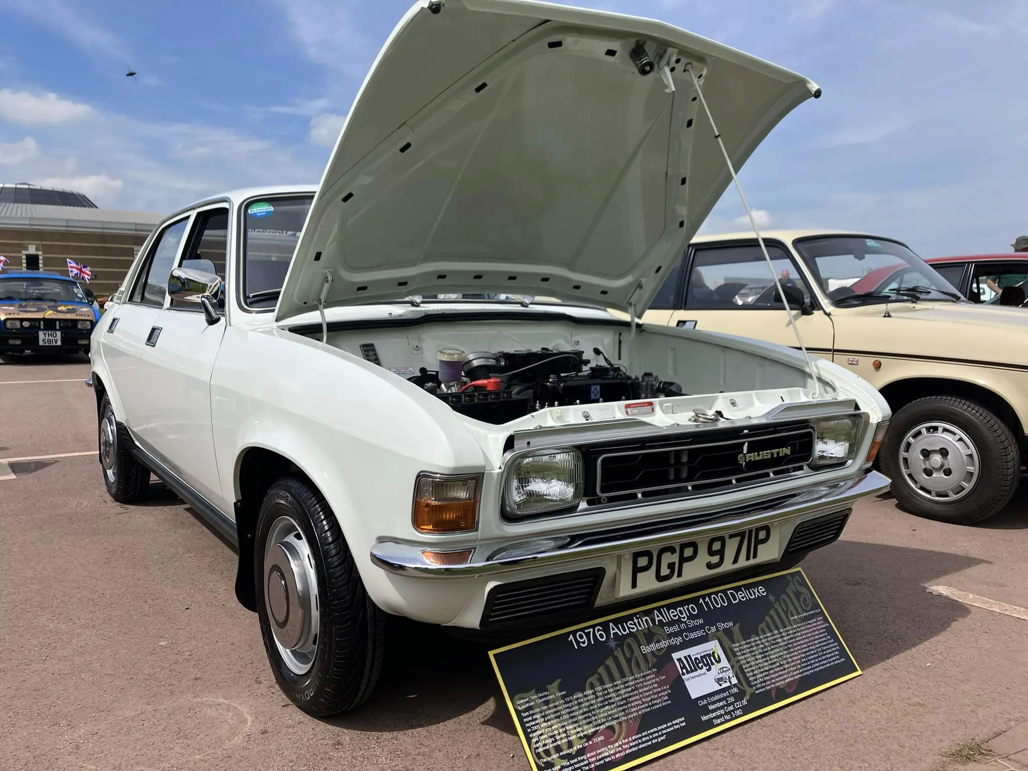 White car with bonnet up