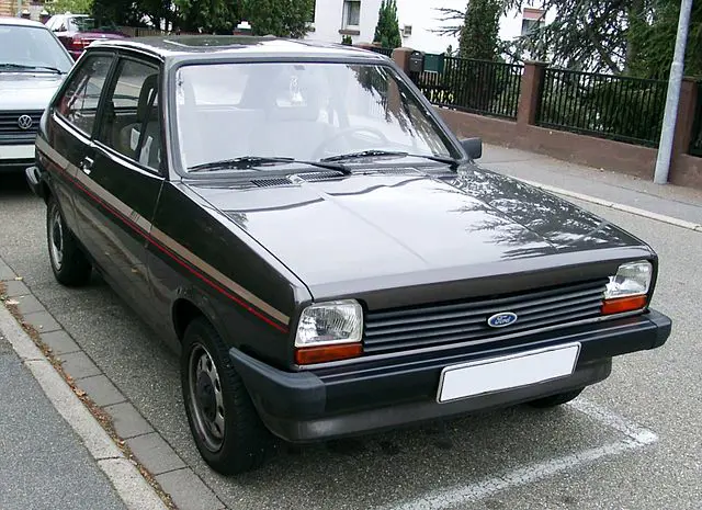 classic ford fiesta parked on street