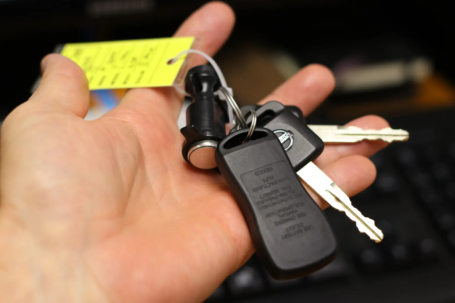 A person holding a set of campervan keys
