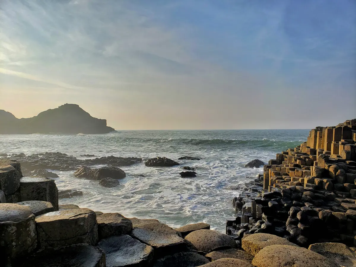 The Giants Causeway with naturally formed hexagonal pillars littering a coastline