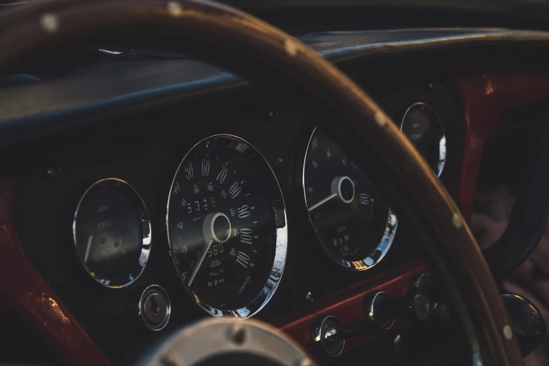 The interior and dashboard of a Triumph car