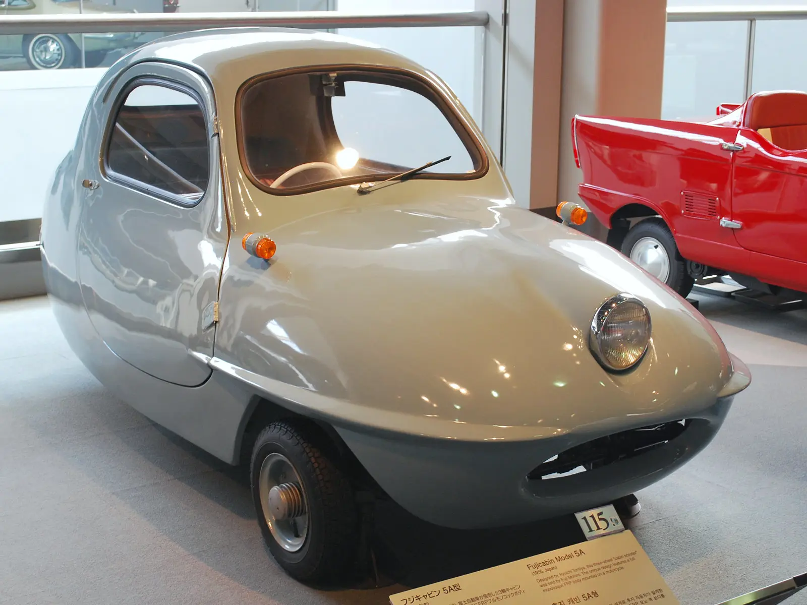 Blue three-wheeled car