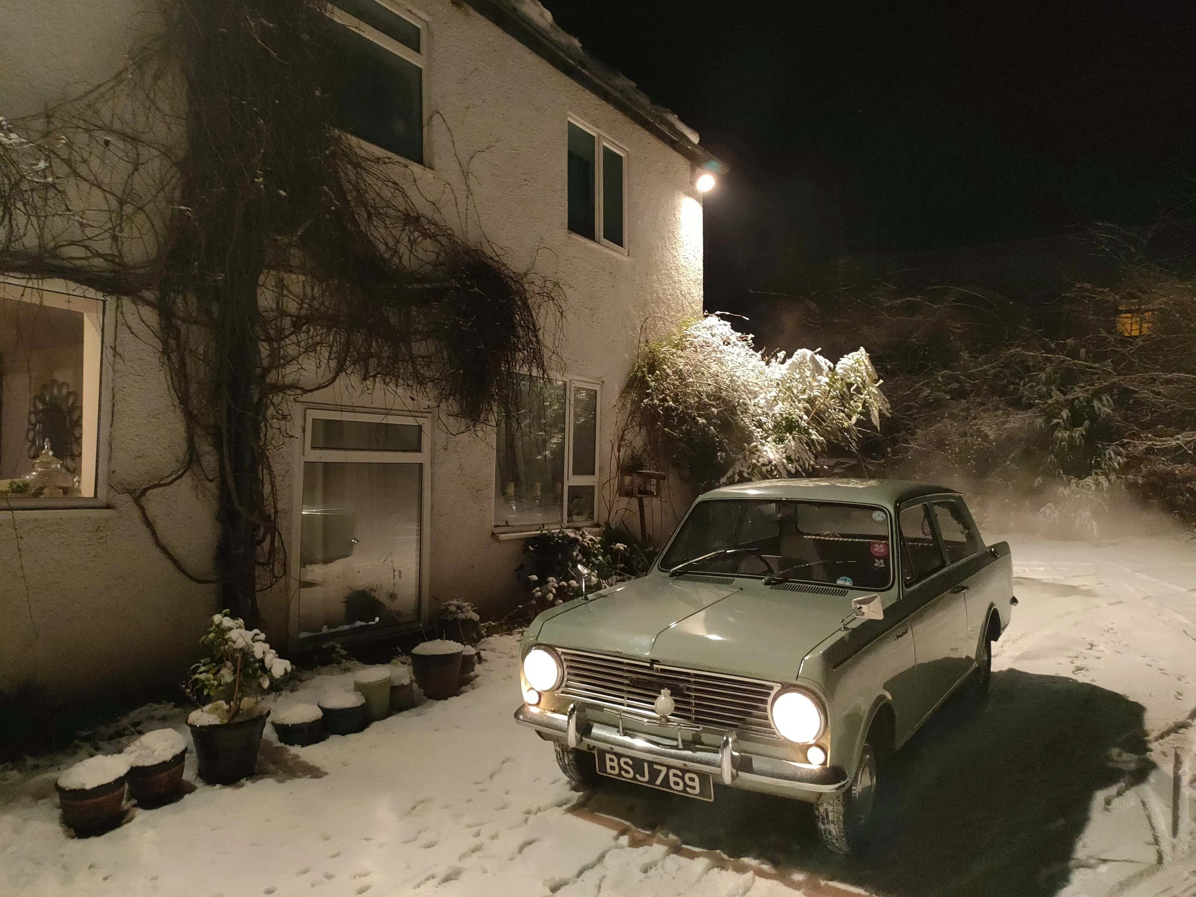 Snowy car and house